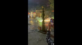 A mispositioned licensed firework in Vietnam fires unpredictably after being accidentally flipped upside down during Lunar New Year celebrations.