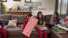 Sisters fearful as younger brother unwraps Nerf gun for Christmas