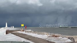 Rapidly intensifying winter storm at Sodus Point Lighthouse, New York, USA