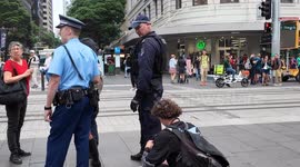 Woman appears to be arrested for ‘globalise the intifada’ writing on jacket in Sydney, Australia