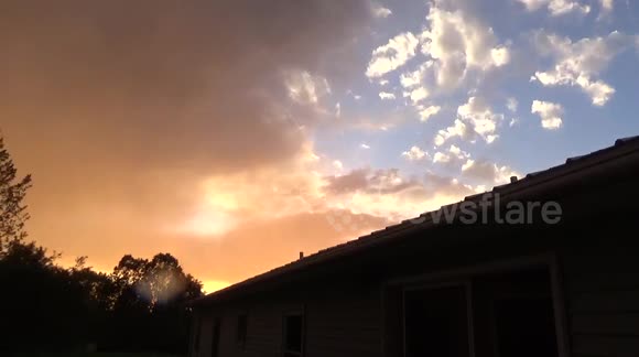 'Strange' sky goes from clear blue to stormy orange and rainbows