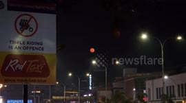 Wolf Supermoon creates a stunning streetlamp illusion in India