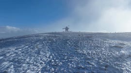 Snow falls on 'giant' in Northern Irish mountain range