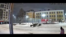 Woman slips on snowy sidewalk in Amsterdam, Netherlands