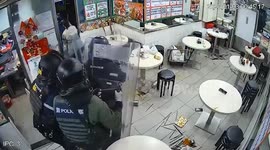 Furious female restaurant customer fights 12 armed police because 'app payment was not working'