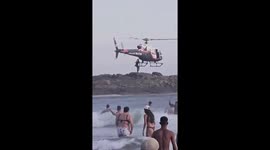 Helicopter rescues stranded man at beach in Brazil