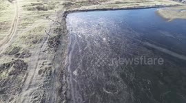 UK Snow: Frozen Flood Water Makes For Ice Rink In Oxford