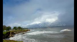 Double rainbow forms over coastal cliffs in Santa Cruz, California, USA