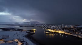Sunset snow shower over Stromness harbor, Orkney Islands, Scotland, UK