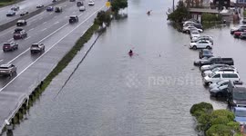 Residents kayak in floodwaters during high tide in Marin County of California