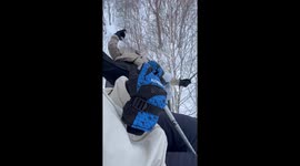 Influencer dangles from ski chairlift for dramatic selfie in Japan