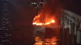 Speedboats damaged as fire rips through pier on popular tourist island
