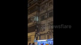 China: Chinese men climbed a building to save a child hanging from a fourth-floor window
