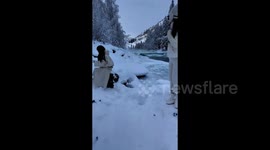 Terrifying ice surge caught on camera as tourists flee for their lives after calm river suddenly explodes into dangerous torrent