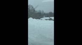 Massive lake-effect snow buries homes with towering roof drifts in New York, USA