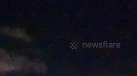 Starlink satellite convoy seen crossing night sky in Japan