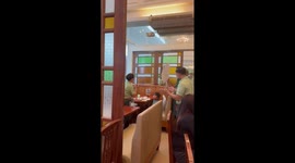 Caring restaurant staff sing for young boy eating alone on his birthday