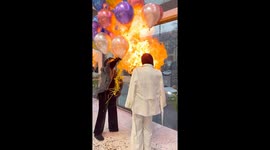 Birthday balloons explode in woman's face as family surprise her