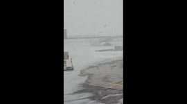 Heavy snow disrupts operations at Charles de Gaulle Airport Terminal 1 in Paris, France