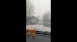 Snow slides off car roof and blocks windshield while driving in Shaanxi, China