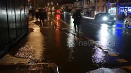 Heavy rain hits Whalthamstow in East London, causing huge puddles to form on pavements