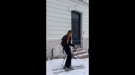 Woman skis through Montmartre streets amid rare snowfall in Paris, France