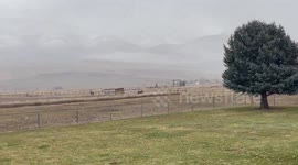 Light snowfall creates calm rural scene in Eden, Utah, USA