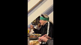 Dog cheekily steals food at the table in Burton, United Kingdom