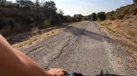 Cyclist crashes after fast overtake on rough road in Pineda de Mar, Barcelona, Spain
