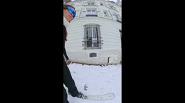 Woman makes most of snow-covered Paris streets by skiing down streets