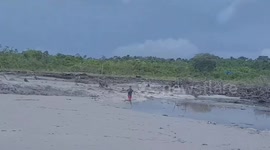 Locals flee as tidal river surges inland in Indonesia