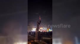 Iran: Lion and Sun Flag Raised Over Khomeini Statue