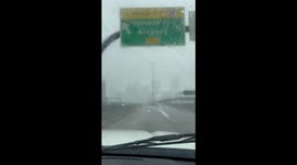 Snowfall reduces visibility along I-93 near downtown Boston, Massachusetts, USA