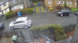 Car slams into parked vehicle and lands upside down - driver crawls out, walks away