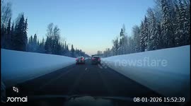 Car crashes into ditch after failed overtake on snowy road in Leningrad, Russia