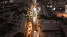 Aerial View: Cars Navigate Treacherous Roads in Newtown During Storm Goretti