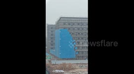 China: Chinese construction workers dismantle steel mesh in ant like pattern