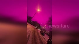 UK: Eerie Pink Sky Covers Birmingham Streets Amid Storm Goretti