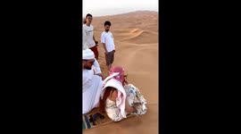 Snowboard Sliding Down Desert Sand Dune