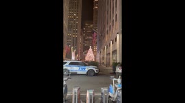 Man Dressed as a Christmas Tree Riding a Bike Through NYC