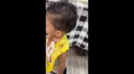 Child hilariously eats chocolate ice cream in Melaka, Malaysia