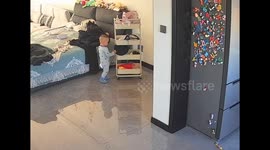 Curious child hits wall while wearing police hat in Liaoning, China