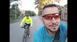 Biking mishap as friend loses balance in Sloviansk, Ukraine