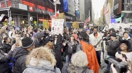 New York City: Anti-Trump demonstrators dance near Times Square with music playing