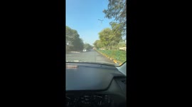 Driver turns roadside watering into an impromptu car wash in Gurgaon, India