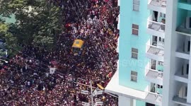 Thousands of Catholics cross bridge during Black Nazarene procession in Manila