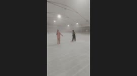 Friends topple over while learning to ice skate together