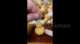 China: Electric tool creates tree patterns on gourd in China