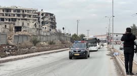 Convoy carrying YPG/SDF members departs from Aleppo's Sheikh Maksoud