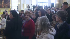 Catholic Christians perform pilgrimage rituals along Jordan River